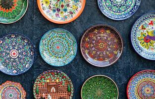 Arabic painted ceramic plates on the wall. photo