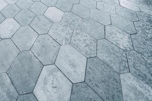 The texture of hexagonal tiled pavement with perspective. photo