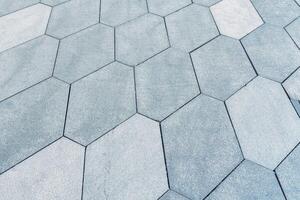 The texture of hexagonal tiled pavement with perspective. photo