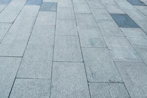 The texture of a tiled pavement with perspective. photo