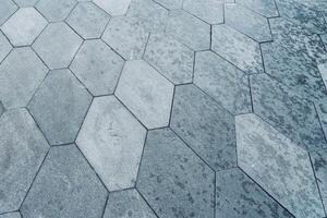 The texture of hexagonal tiled pavement with perspective. photo