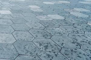 The texture of hexagonal tiled pavement with perspective. photo