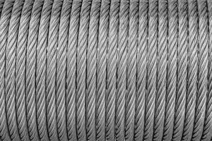 el textura de un nuevo inoxidable acero cable envuelto en un carrete. resumen antecedentes. foto