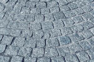el textura de un Roca antiguo pavimento con un perspectiva. foto