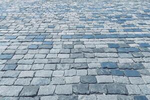 The texture of a stone old pavement with a perspective. photo