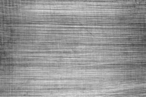 Monochrome texture of shiny scratched metal. Abstract background. photo