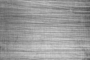 Monochrome texture of shiny scratched metal. Abstract background. photo