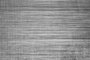 Monochrome texture of shiny scratched metal. Abstract background. photo