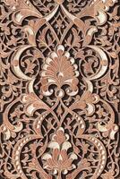 Fragment of an ancient carved wooden door. Ornate. photo