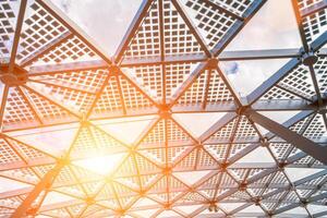 Glass metal framed roof of a modern building. Abstract background. photo