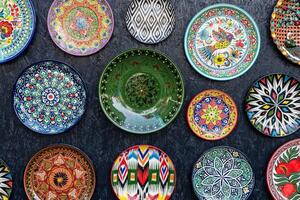 Arabic painted ceramic plates on the wall. photo