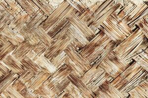 The texture of the frame of an oriental building made of woven bamboo. Abstract background. photo