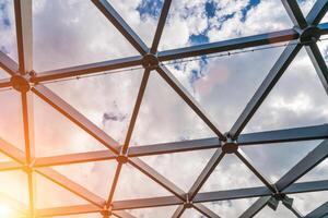 Glass metal framed roof of a modern building. Abstract background. photo