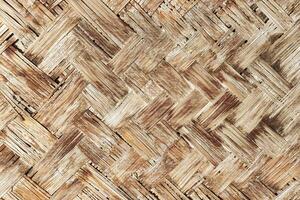 The texture of the frame of an oriental building made of woven bamboo. Abstract background. photo