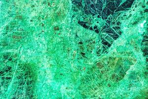 Texture of green marble tiles with scratches. Abstract background. photo