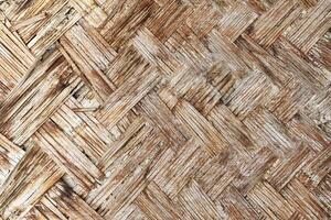 The texture of the frame of an oriental building made of woven bamboo. Abstract background. photo