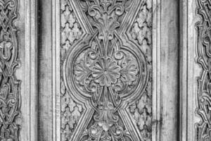 Carved wooden doors with patterns and mosaics. photo