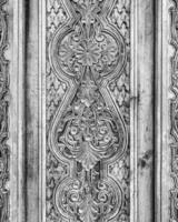 Carved wooden doors with patterns and mosaics. photo