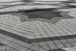 The texture of a stone old pavement with a perspective. photo