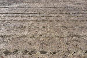 The texture of a stone old pavement with a perspective. photo