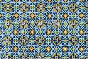 Geometric traditional Islamic ornament. Fragment of a ceramic mosaic. photo