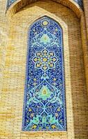 Geometric traditional Islamic ornament. Fragment of a ceramic mosaic. photo