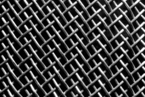 monocromo textura de un brillante metal colador o rallar. resumen antecedentes. foto