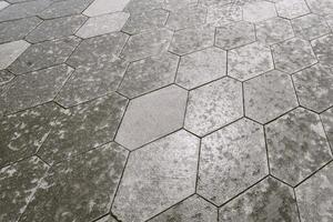 The texture of hexagonal tiled pavement with perspective. photo