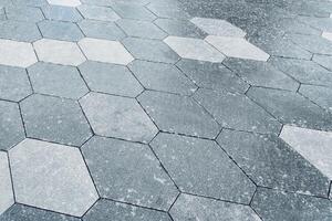 The texture of hexagonal tiled pavement with perspective. photo