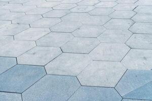 The texture of hexagonal tiled pavement with perspective. photo