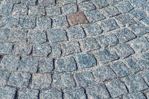 The texture of a stone old pavement with a perspective. photo