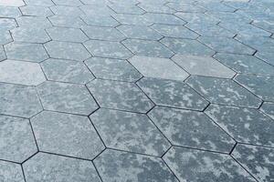 The texture of hexagonal tiled pavement with perspective. photo