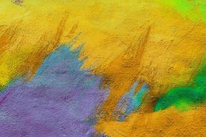 Colorful graffiti painted on a wall. Abstract urban background. Spray painting art. photo