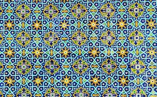 Geometric traditional Islamic ornament. Fragment of a ceramic mosaic. photo