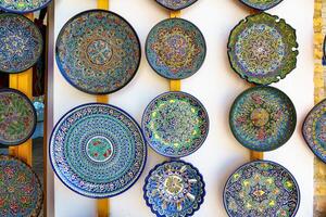 Arabic painted ceramic plates on the wall. photo