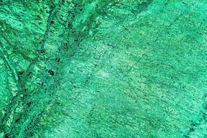 Texture of green marble tiles with scratches. Abstract background. photo