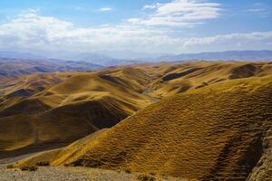 A deserted part of the Zaamin nature reserve in Uzbukistan on a sunny summer day. View of the mountains. photo