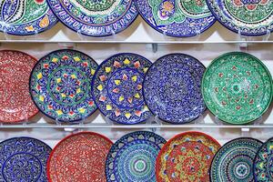 Arabic painted ceramic plates on the wall. photo