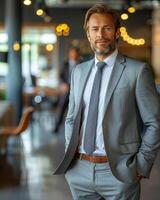 Businessman in formal attire standing in office setting photo