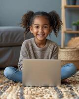 Young girl interacts with laptop while seated on floor photo