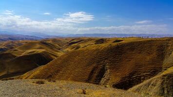 A deserted part of the Zaamin nature reserve in Uzbukistan on a sunny summer day. View of the mountains. photo