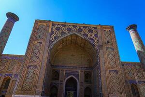 Samarkand, Uzbekistan - September 27, 2023 Registan Square with Ulugbek Madrassah, the famous square in Samarkand, included in the UNESCO World Heritage Site. photo