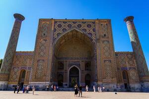 Samarkand, Uzbekistan - September 27, 2023 Registan Square with Ulugbek Madrassah, the famous square in Samarkand, included in the UNESCO World Heritage Site. photo