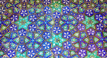 Geometric traditional Islamic ornament. Fragment of a ceramic mosaic. photo