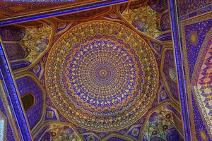 Ornament of the dome and interior of the Registan mosque in Samarkand, Uzbekistan. Muslim oriental traditional geometric ornament. photo