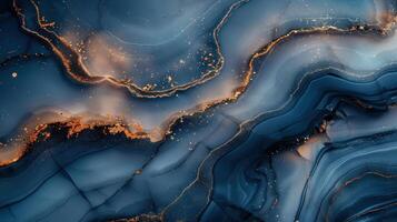 Swirling blue and gold patterns in an abstract marble surface photo