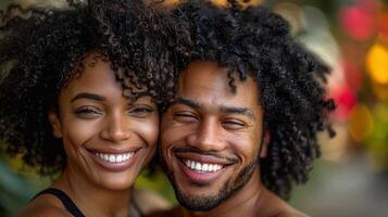 A man and woman standing together, smiling for a camera photo