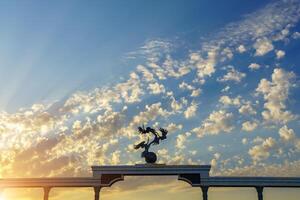 Tahkent, Uzbekistan - October 16, 2023 Independence Memorial at Independence Square in Tashkent illuminated at sunset with cloudy sky. photo