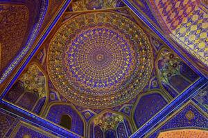 Ornament of the dome and interior of the Registan mosque in Samarkand, Uzbekistan. Muslim oriental traditional geometric ornament. photo