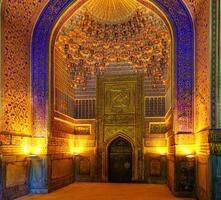 Ornament of the interior of the Registan mosque in Samarkand, Uzbekistan. Muslim oriental traditional geometric ornament. photo